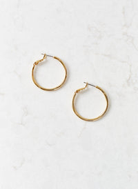 gold-small-hoop-earrings_studio_image 