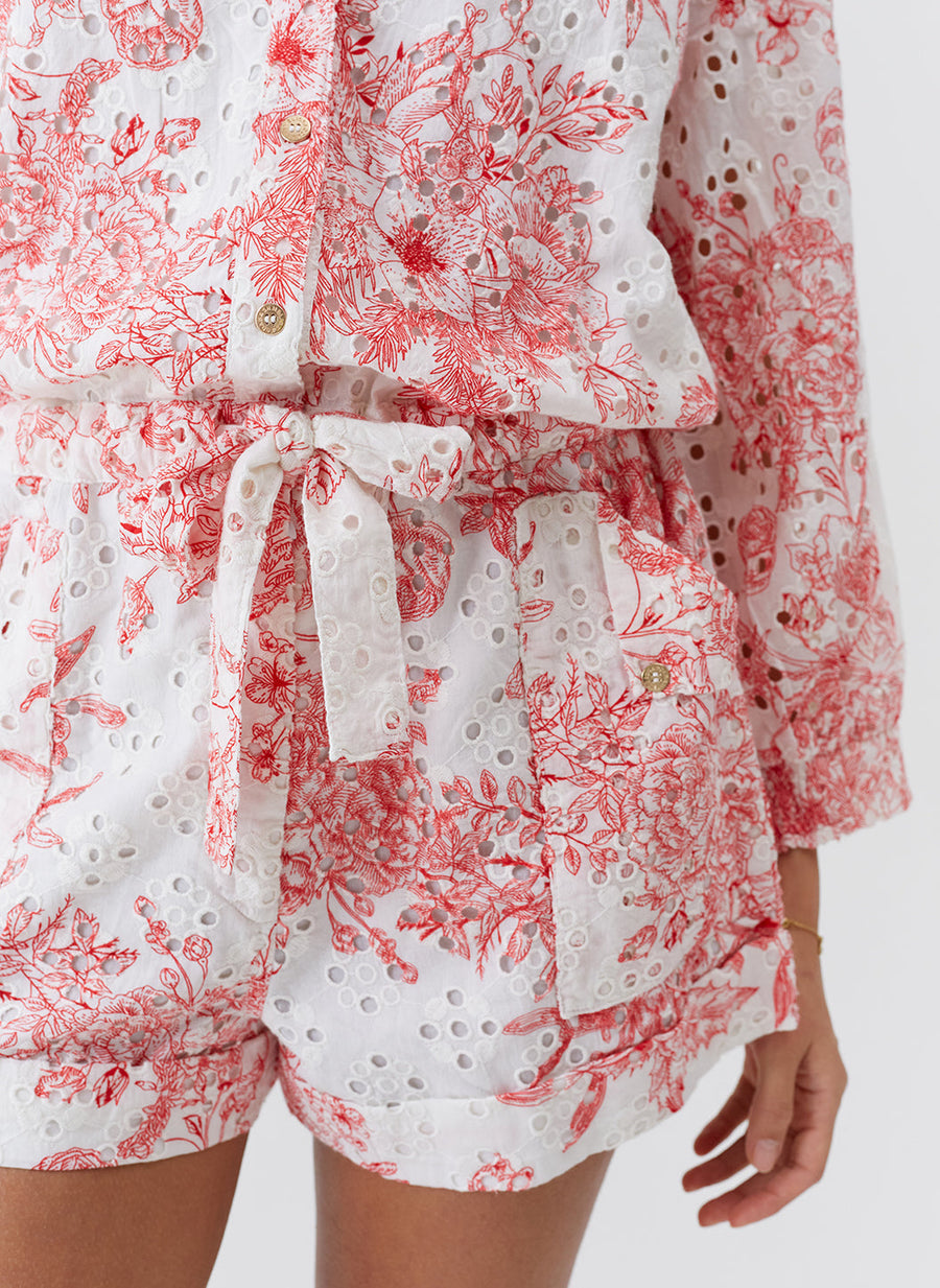 suri-coastal-red-playsuit_model_2026_closeup 